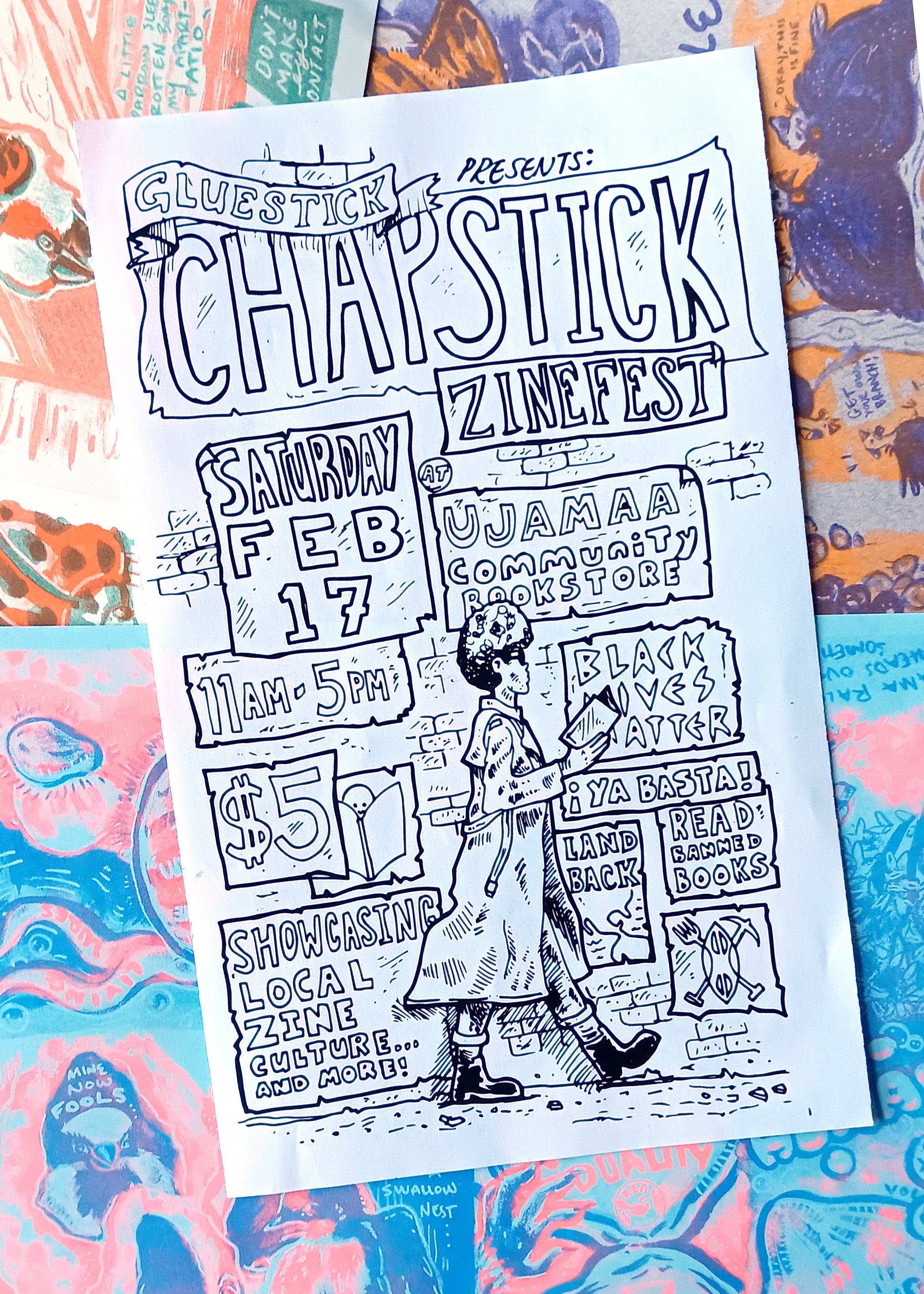 Photo of an event flyer on risograph prints in the background. Flyer says "Gluestick Chapstick Zinefest Saturday Feb 17th 2024 11am-5pm $5, showcasing local zine culture and more"