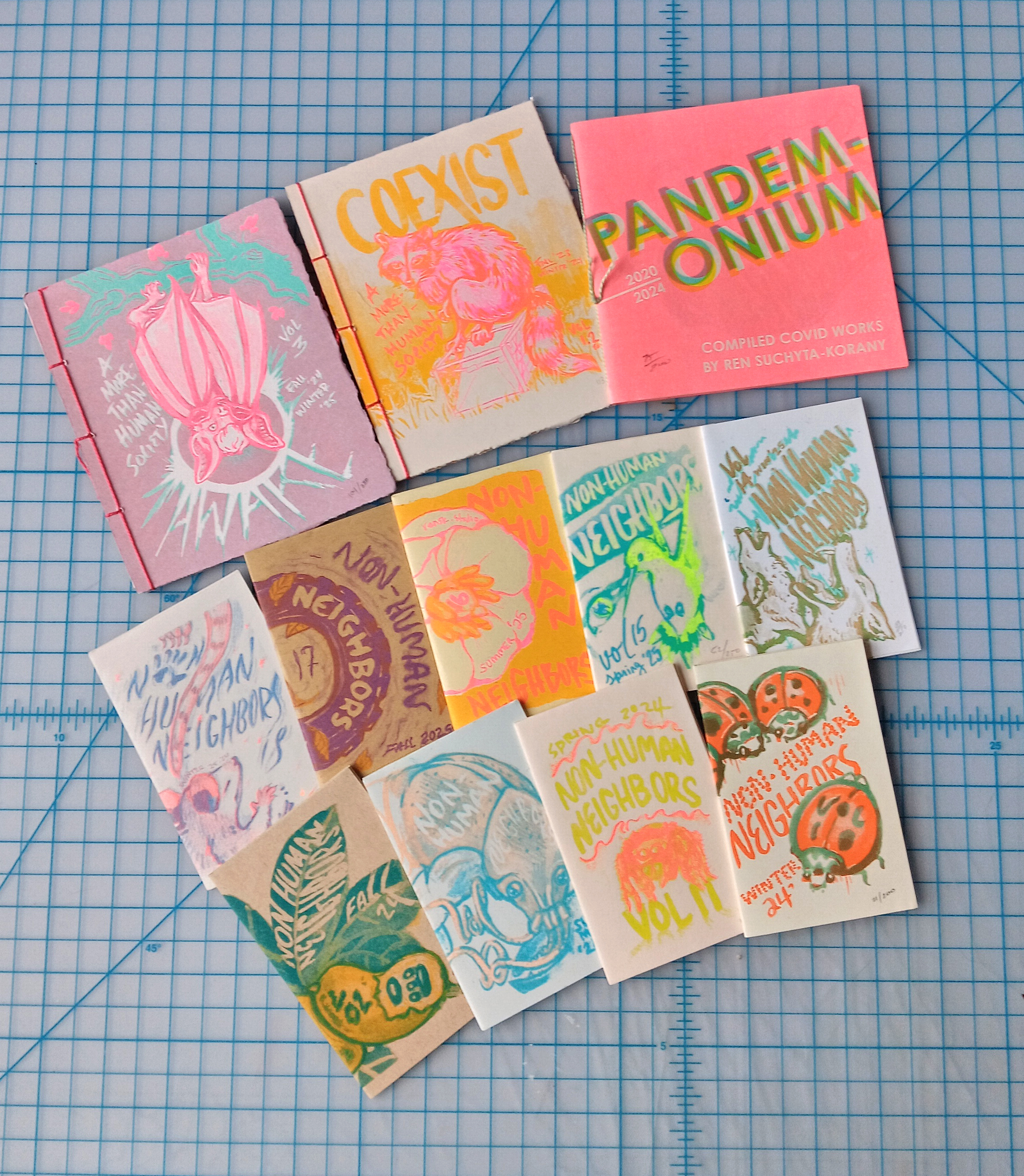 a group of zines on a graphing table